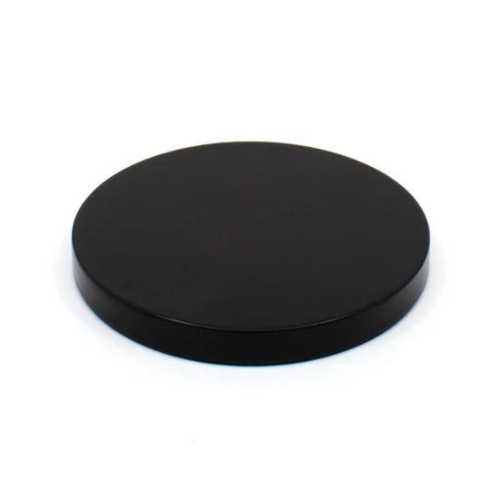 Black circular object on a white background