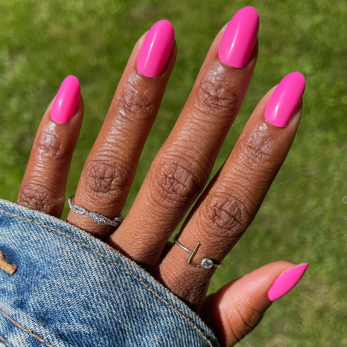 Neon Flamingo | Oval | Medium press-on nails in bright electric pink with a smooth finish for an easy at-home manicure