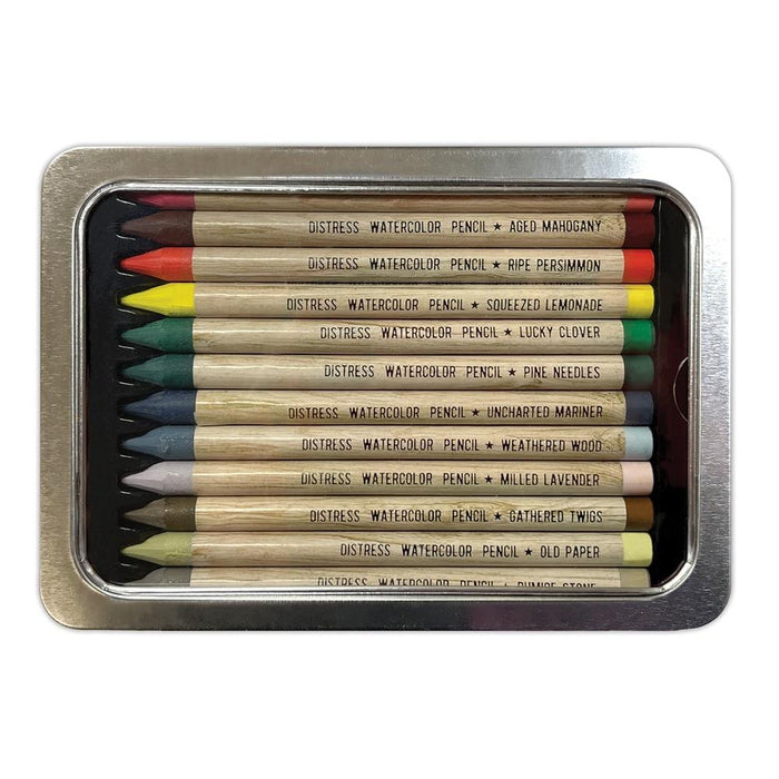 Tim Holtz - Distress Watercolor Pencils 12/Pkg Set 5. These are woodless watercolor pencils formulated to achieve vibrant coloring effects on porous surfaces. Water-reactive pigments are ideal for water coloring, shading, sketching, etc. Available at Embellish Away located in Bowmanville Ontario Canada.