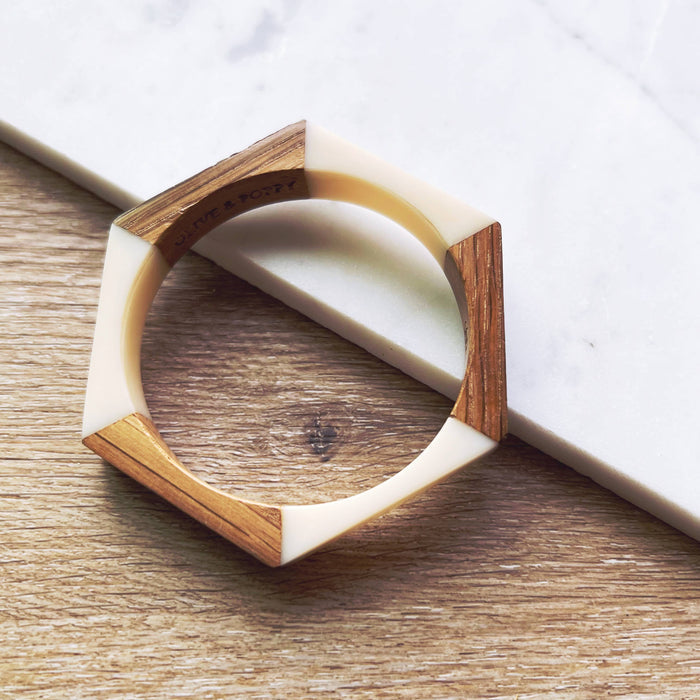 Olive and Poppy 1/2-inch barrel bracelet with textured metal design, shown on a neutral background.