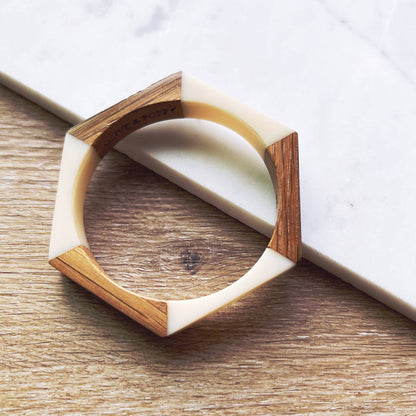 Olive and Poppy 1/2-inch barrel bracelet with textured metal design, shown on a neutral background.