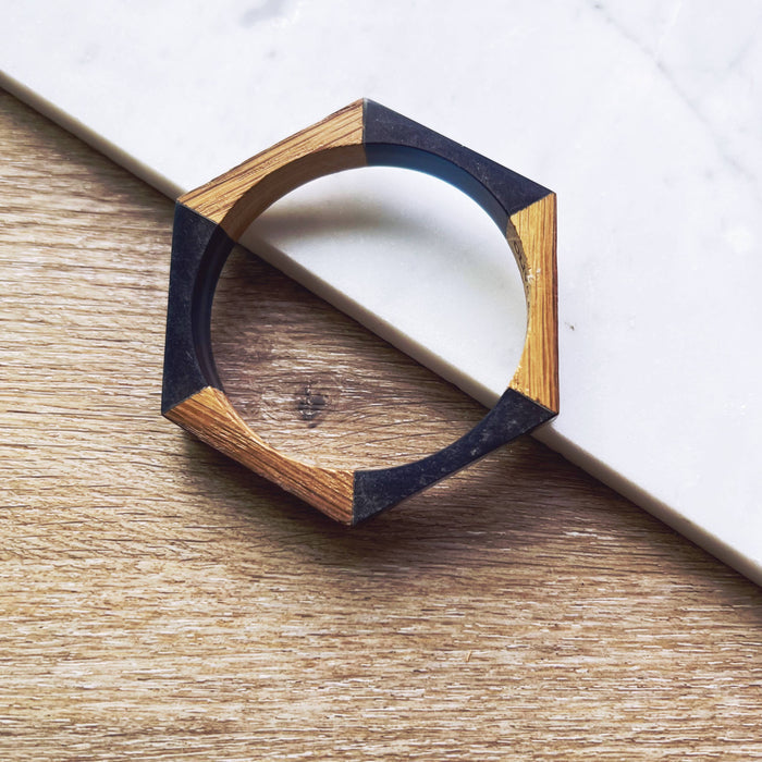 Olive and Poppy 1/2-inch barrel bracelet with textured metal design, close-up view showing detailed craftsmanship and bracelet clasp.