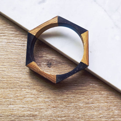 Olive and Poppy 1/2-inch barrel bracelet with textured metal design, close-up view showing detailed craftsmanship and bracelet clasp.