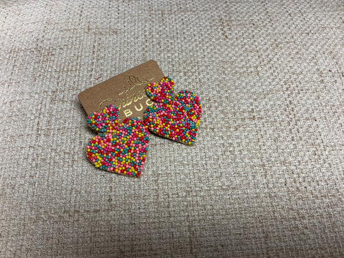 Heart-shaped cupcake sprinkle earrings by Princess & Buck, featuring colorful, playful earrings with cupcake sprinkle design.