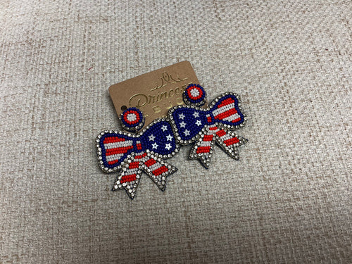 USA Bow earrings by Camel Threads featuring patriotic red, white, and blue bow design for stylish accessory.