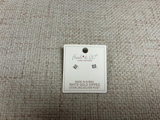 SM Style cubic zirconia stud earrings with sparkling clear stones set in silver-tone metal on a white background.