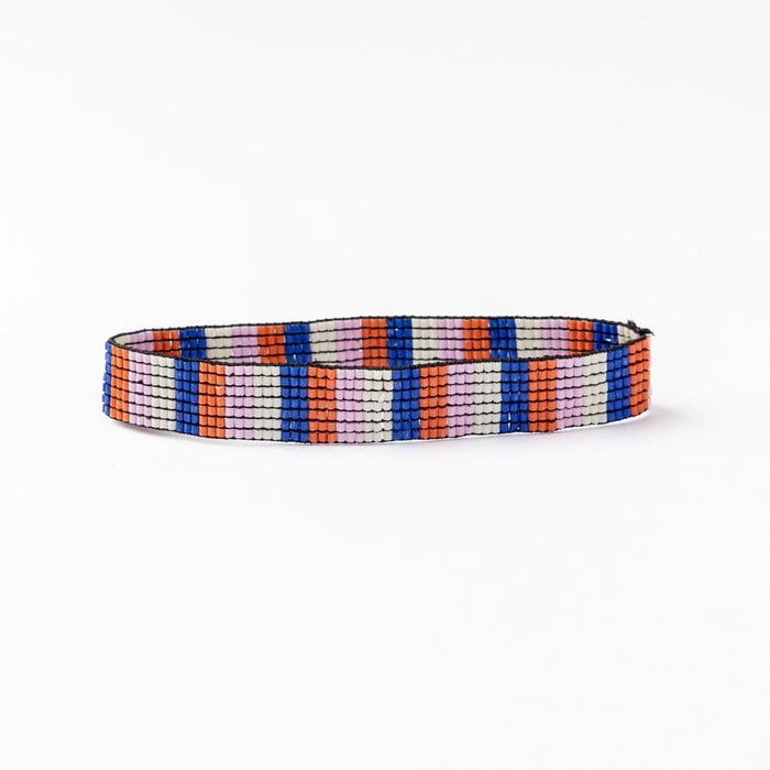 Beaded stretch bracelet with vertical multicolor stripes in blue, coral, and white