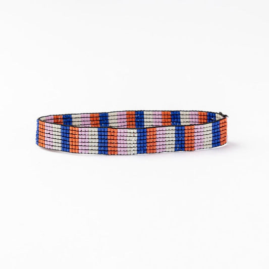 Beaded stretch bracelet with vertical multicolor stripes in blue, coral, and white