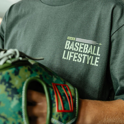 Close up of Youth Dark Grey T- shirt with green lettering that says 'BASEBALL LIFESTYLE' in the top right corner