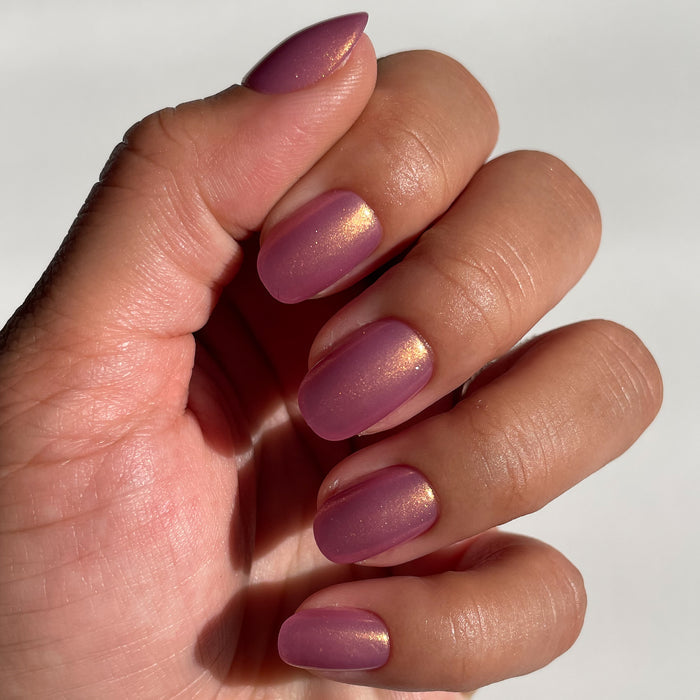 Baby Starfish | Round | Extra Short coral iridescent press-on nails in an extra short round shape for an easy mani