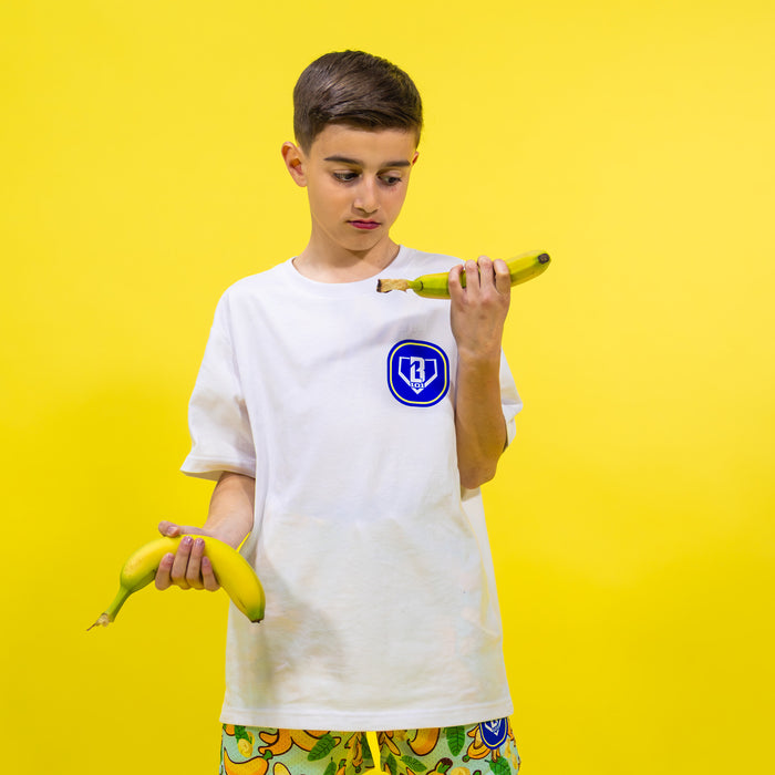 Adult model wearing white Banana Tropical graphic tee
