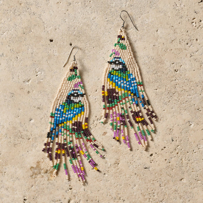 Beaded bird fringe earrings by Ten Thousand Villages featuring colorful beads and feather-like fringe design.