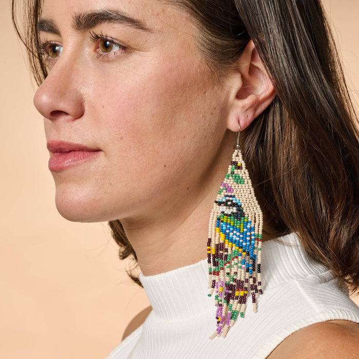 Beaded bird fringe earrings with colorful beads and metal accents, stylish dangle earrings from Ten Thousand Villages.
