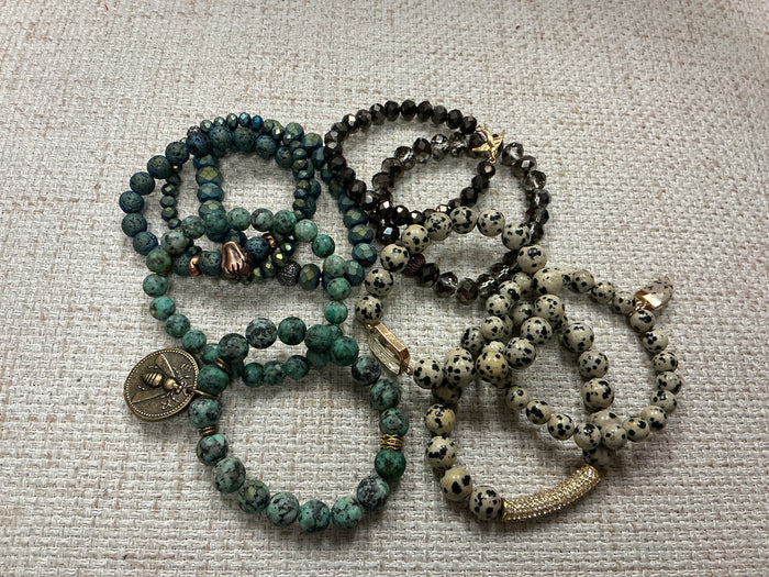 Stacked beaded bracelet set by American Unique Group featuring colorful, round beads on a stretchy bracelet for a stylish look.
