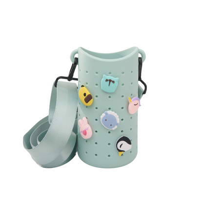 Koala-themed mint green sling bag with perforated body, colorful animal patches and strap