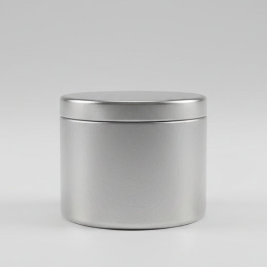 Candle tin on grey background