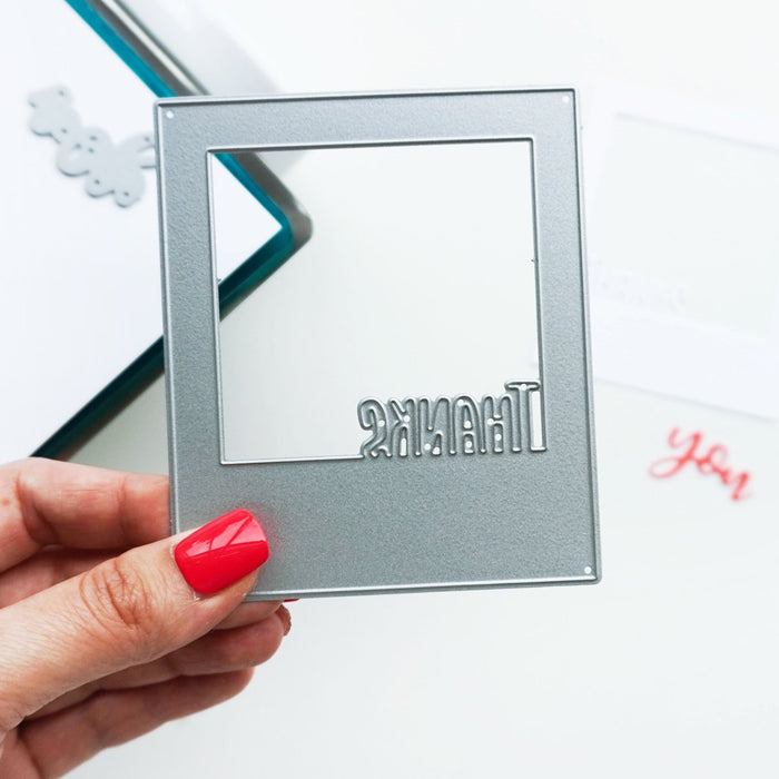 Catherine Pooler - Dies - Instant Thanks. Inspired by the classic Polaroid are the Instant Happy and Instant Thanks Dies. These versatile dies can be used in so many ways! With the secondary dies, you can cut the word out of the frame for another look. Illustrated by Leslie Dunegan. Stainless steel and are compatible with all standard die cutting machines. Available at Embellish Away located in Bowmanville Ontario Canada.