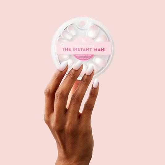 CCT Gradient - Press-On | Short | Round hand with white to sheer pink gradient short round false nails holding nail set packaging