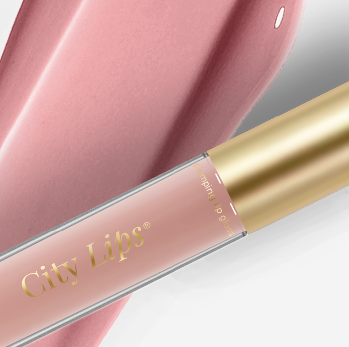 City Lips Pink Nude opaque lip gloss from City Beauty showing a smooth, glossy finish on lips.