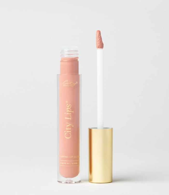 City Lips Pink Nude opaque lip gloss by City Beauty, featuring a smooth, glossy finish on natural-looking lips.