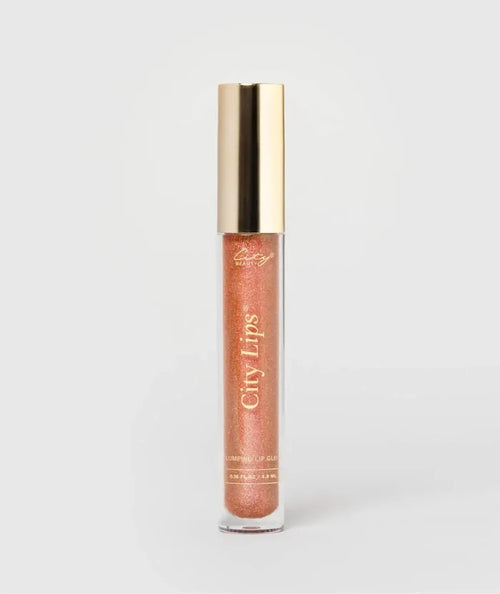 City Lips Sparkling Cider shimmer lip gloss from City Beauty, showcasing a glossy, sparkling finish on smooth lips.