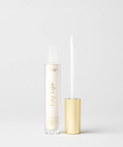 City Lips Midnight Sparkle gold glitter lip gloss applied on lips, showcasing shimmering gold glitter finish and smooth texture.