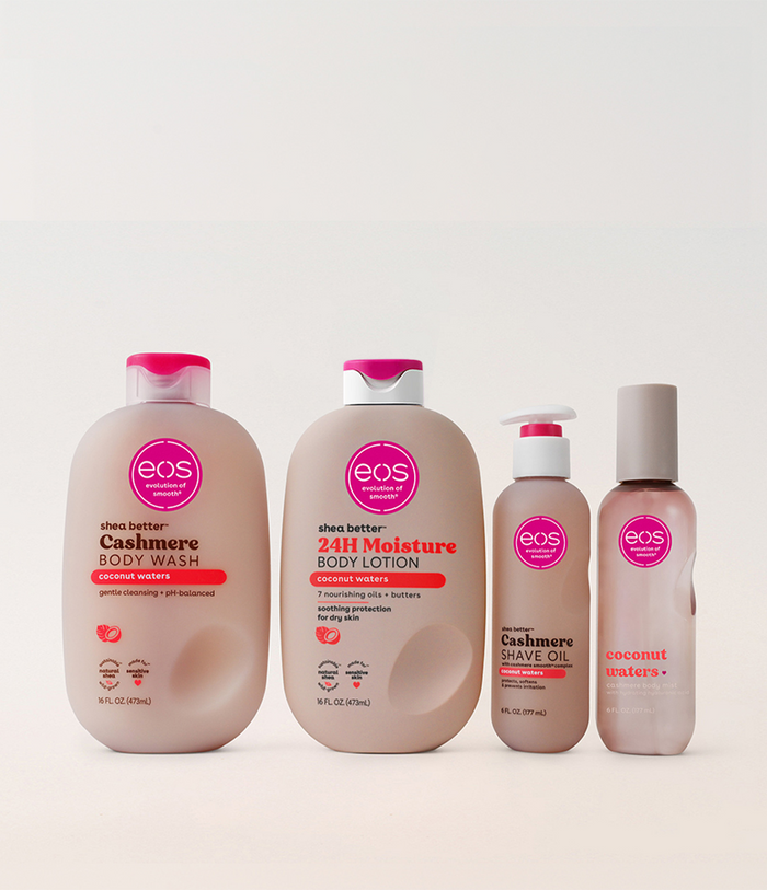 Set of EOS skincare products including body wash, lotion, shave oil, and spray on a white background