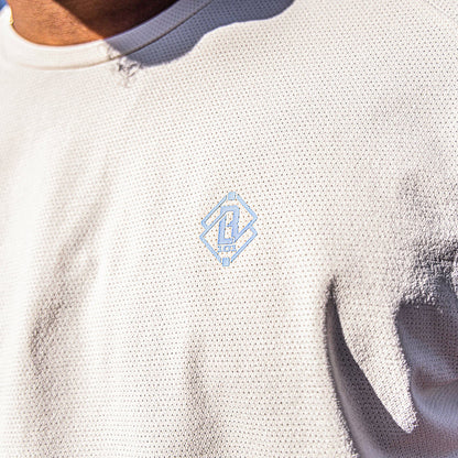 Bone and light blue Diamond Tech graphic tee — front view