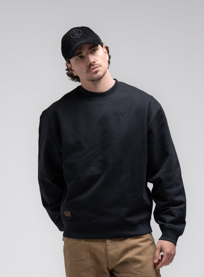 Jack Is 6ft 3" And Wears Size: L | Hem Studio Image Of Model Wearing Dissident Jumper In Obsidian Black (SS Model)