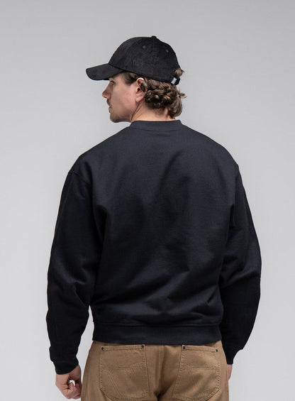 Jack Is 6ft 3" And Wears Size: L | Hem Studio Image Of Model Wearing Dissident Jumper In Obsidian Black (SS Model)