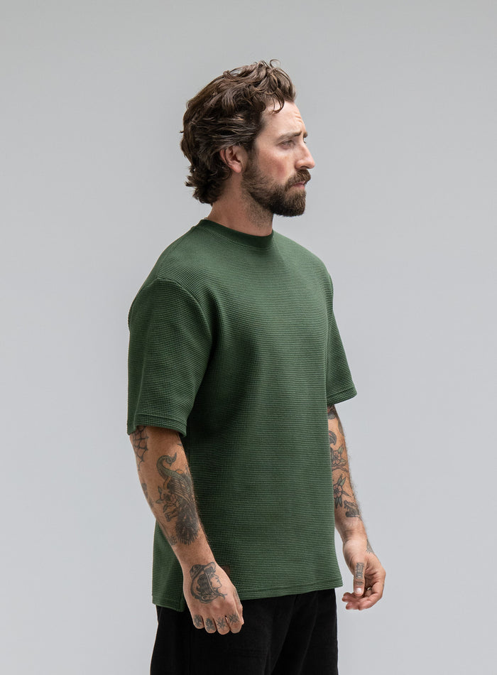 Max Is 5ft 8" And Wears Size: M | Hem Studio Image Of Model Wearing Dissident Waffle Short Sleeve T-Shirt In Forest Green (SS Model)