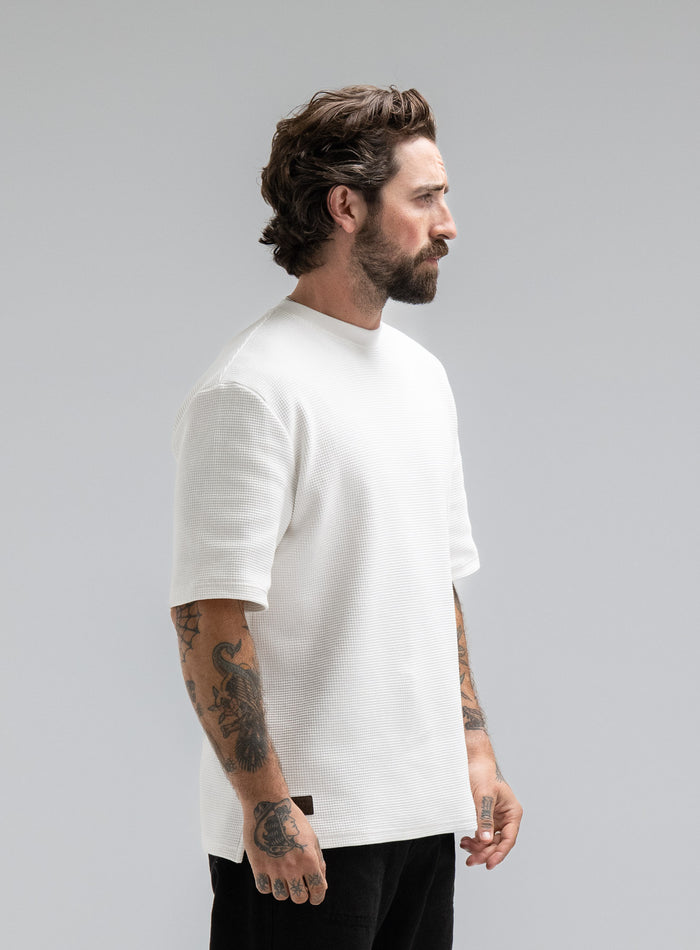Max Is 5ft 8" And Wears Size: M | Hem Studio Image Of Model Wearing Dissident Waffle Short Sleeve T-Shirt In Optic White (SS Model)