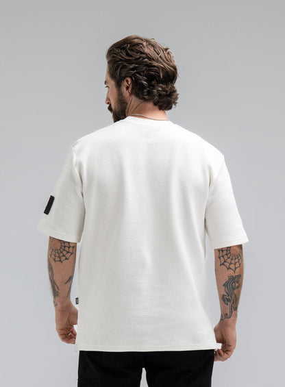Max Is 5ft 8" And Wears Size: M | Hem Studio Image Of Model Wearing Dissident Waffle Short Sleeve T-Shirt In Optic White (SS Model)