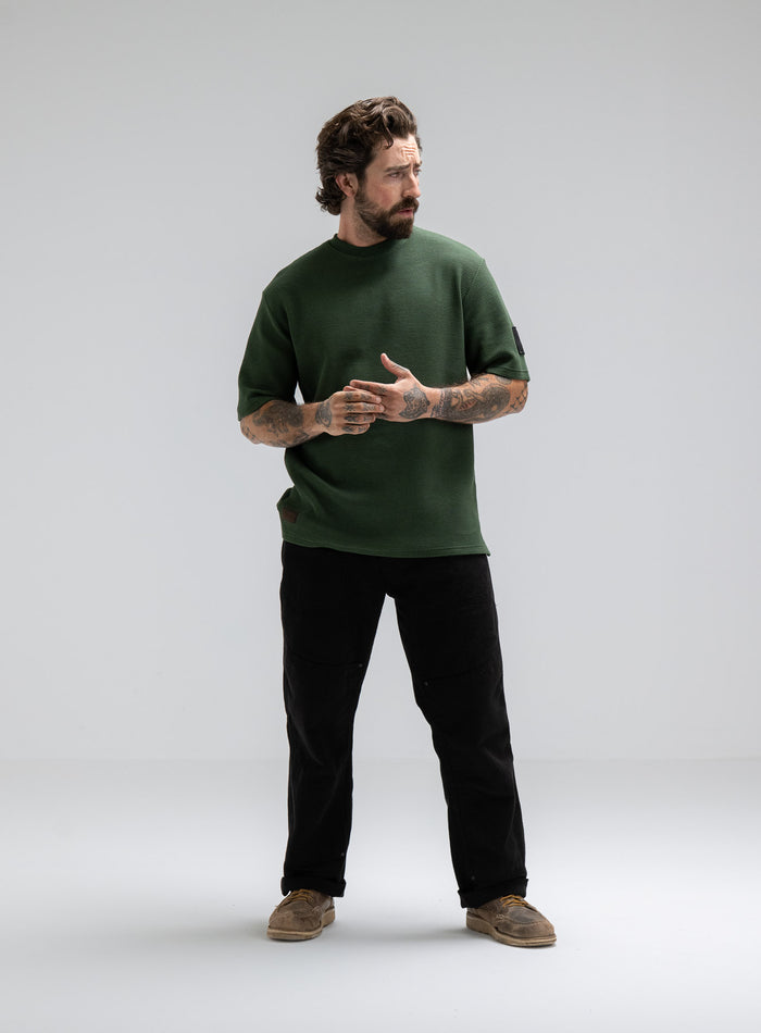 Max Is 5ft 8" And Wears Size: M | Hem Studio Image Of Model Wearing Dissident Waffle Short Sleeve T-Shirt In Forest Green (SS Model)