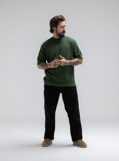 Max Is 5ft 8" And Wears Size: M | Hem Studio Image Of Model Wearing Dissident Waffle Short Sleeve T-Shirt In Forest Green (SS Model)