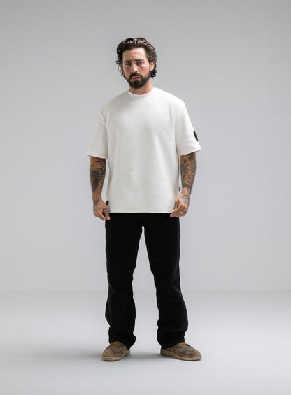 Max Is 5ft 8" And Wears Size: M | Hem Studio Image Of Model Wearing Dissident Waffle Short Sleeve T-Shirt In Optic White (SS Model)