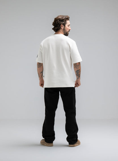 Max Is 5ft 8" And Wears Size: M | Hem Studio Image Of Model Wearing Dissident Waffle Short Sleeve T-Shirt In Optic White (SS Model)