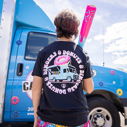 Youth model wearing black youth graphic tee with “Donut Truck” design