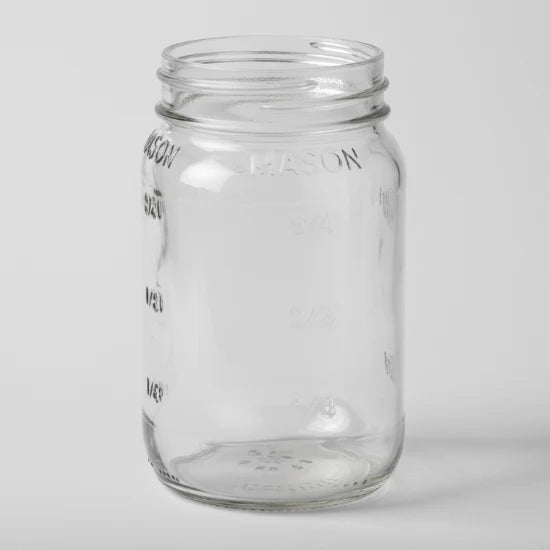 Clear glass mason jar on a white background