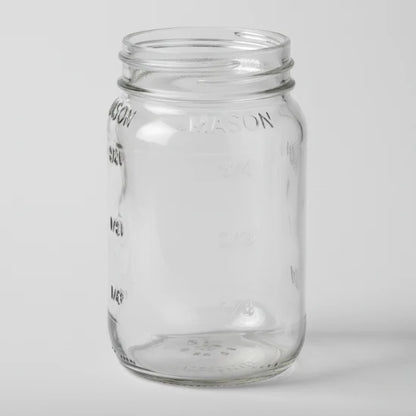 Clear glass mason jar on a white background