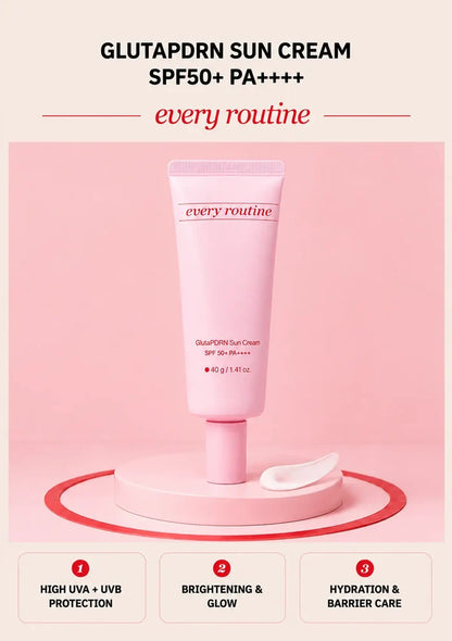 Every Routine GlutaPDRN Sun Cream SPF50 tube with cream texture on a pink podium