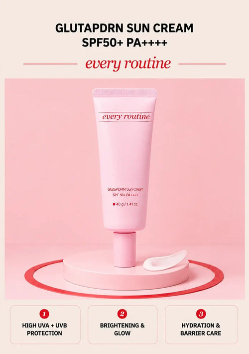 Every Routine GlutaPDRN Sun Cream SPF50 tube with cream texture on a pink podium