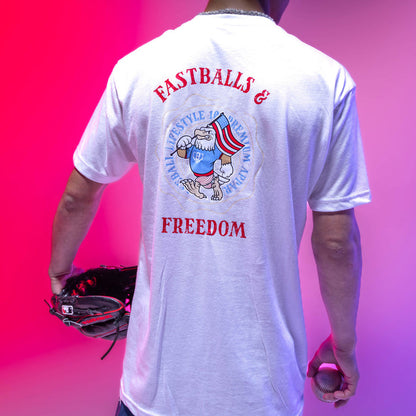 Youth model wearing youth graphic tee with “Fastballs & Freedom” design