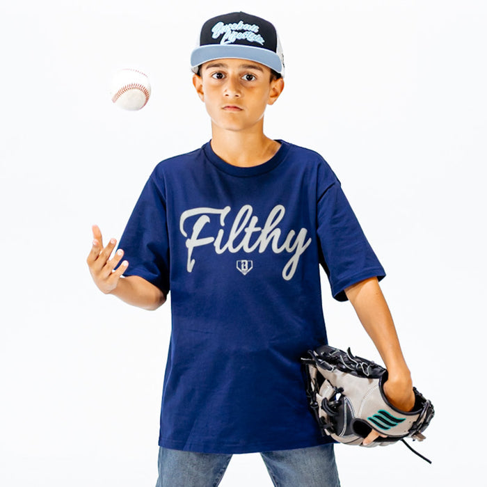 Child wearing a blue 'Filthy' t-shirt with a baseball cap and glove on a white background