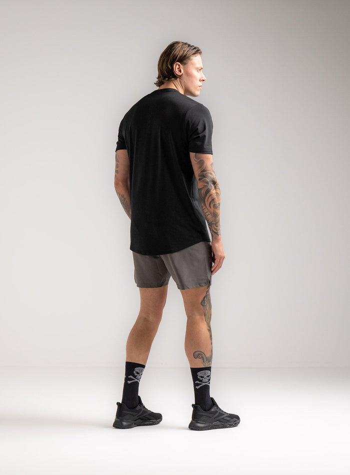 Angus Is 6ft 4" And Wears Size: L | Hem Studio Image Of Model Wearing Force Active Drirelease® Tshirt In Black (SS Model)