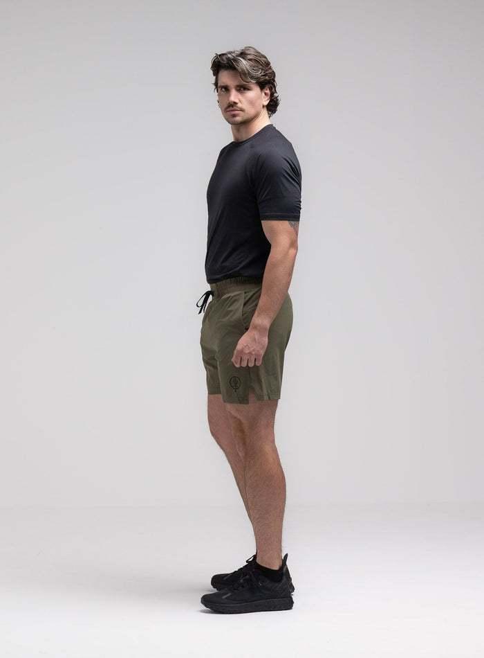 Jack Is 6ft 3" And Wears Size: L | Hem Studio Image Of Model Wearing Force Velocity Motion Shorts In Khaki (SS Model)