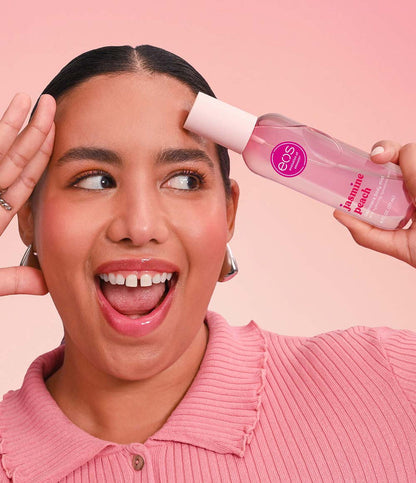 model holding jasmine peach body mist