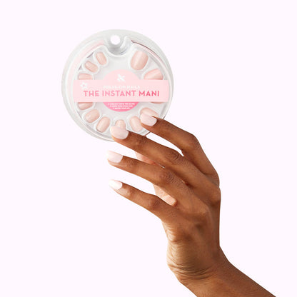 GH - Press-On | Extra Short | Round opaque baby pink false nails on hand holding round press-on nail set