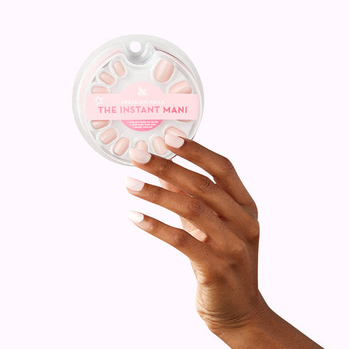 GH - Press-On | Extra Short | Round opaque baby pink false nails on hand holding round press-on nail set