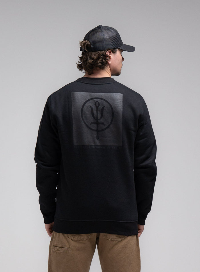 Jack Is 6ft 3" And Wears Size: L | Hem Studio Image Of Model Wearing Insignia Jumper - Black Mark In Obsidian Black (SS Model)